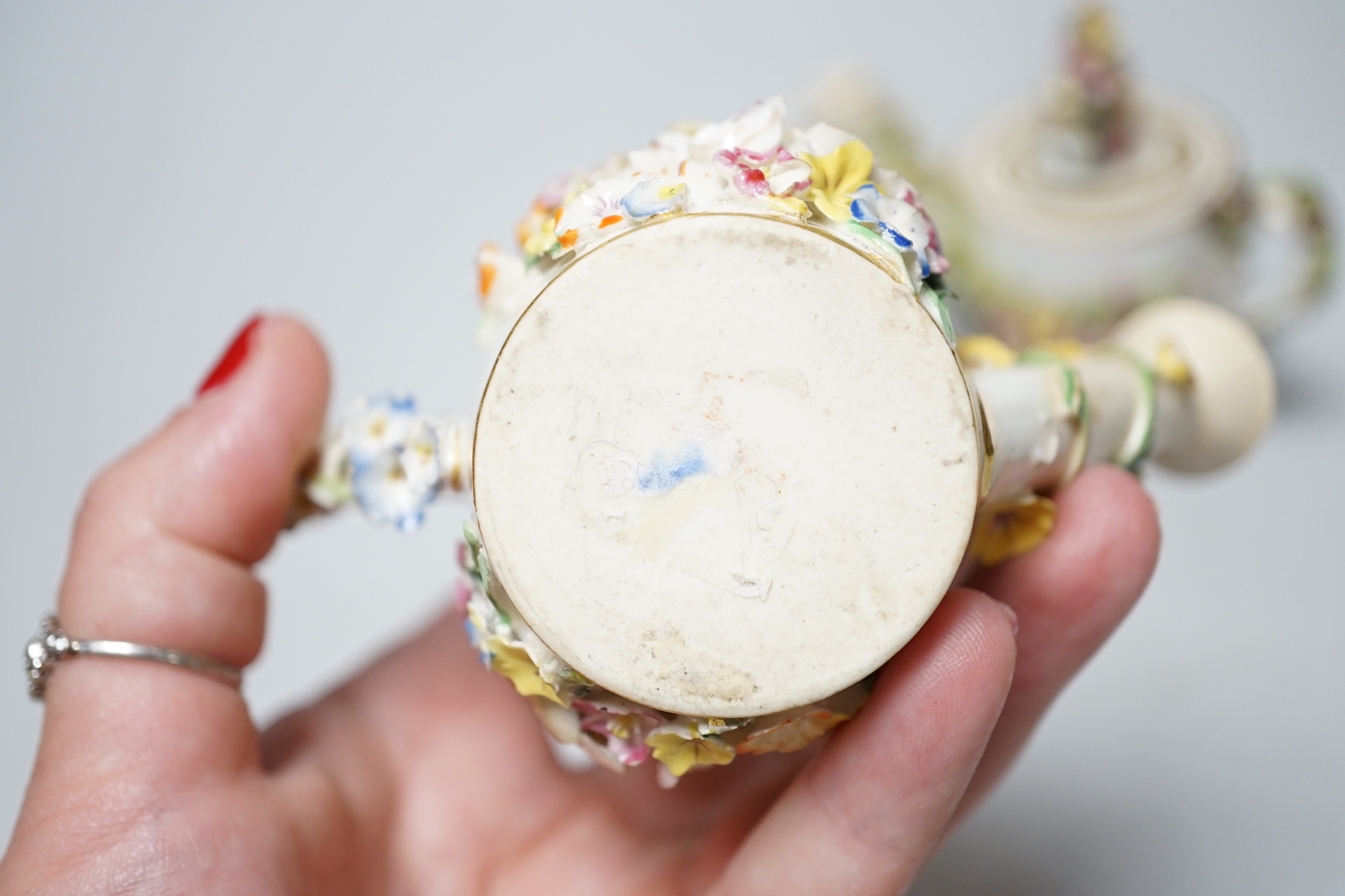 Two Derby porcelain floral encrusted miniature water sprinklers, circa 1825, 9cm high
